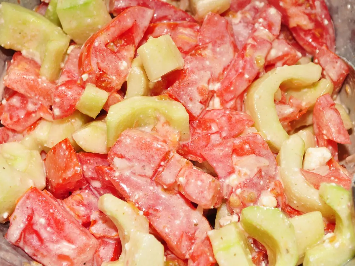 Cucumber and tomato salad with sour cream